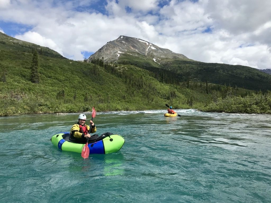 Calm water in a packraft